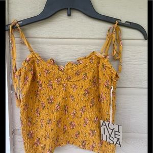 New with tags! Womens/Jrs crop top. Adjustable shoulder ties. Perfect for summer